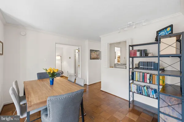 a view of a livingroom with furniture and workspace