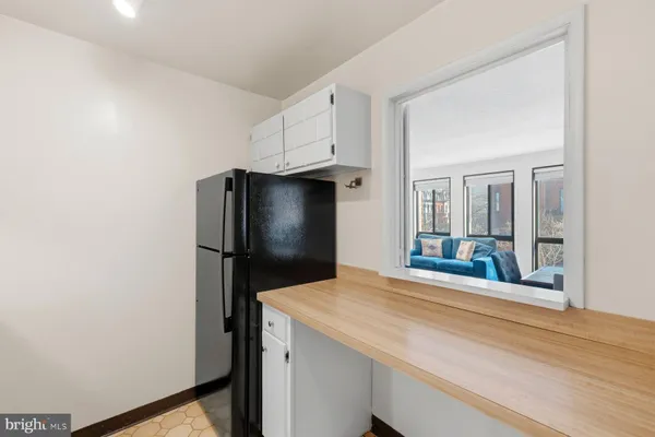 a kitchen with a sink and a stove top oven