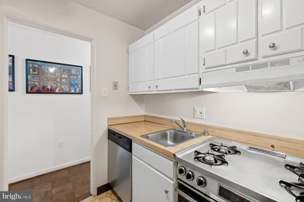 a room with a bed and a mirror