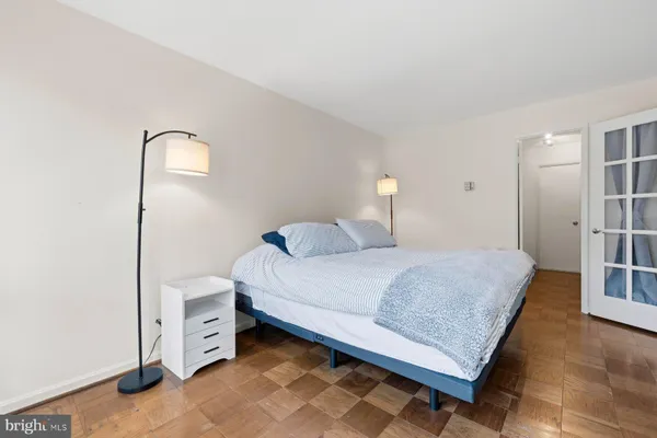 a bedroom with a bed and a table in it