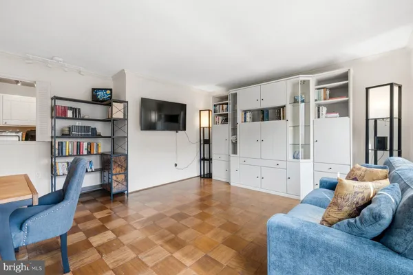 a view of a dining room with furniture and a book shelf