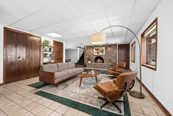 a living room with furniture and a fireplace