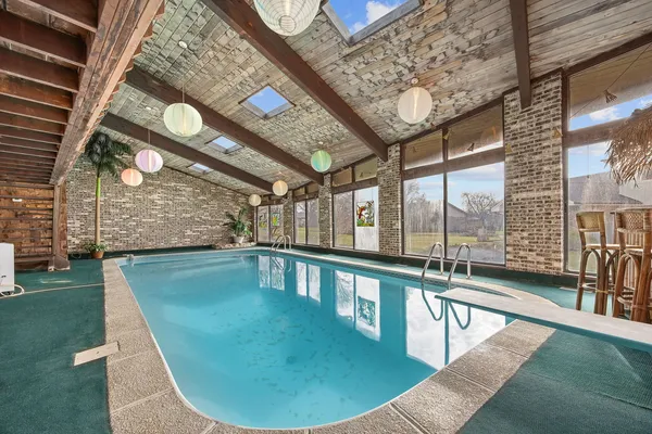 a view of a swimming pool with seating area