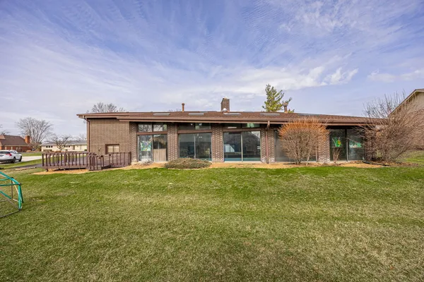 a view of a house with a back yard