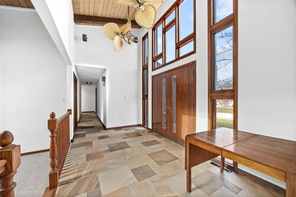 a view of an entryway with a workspace