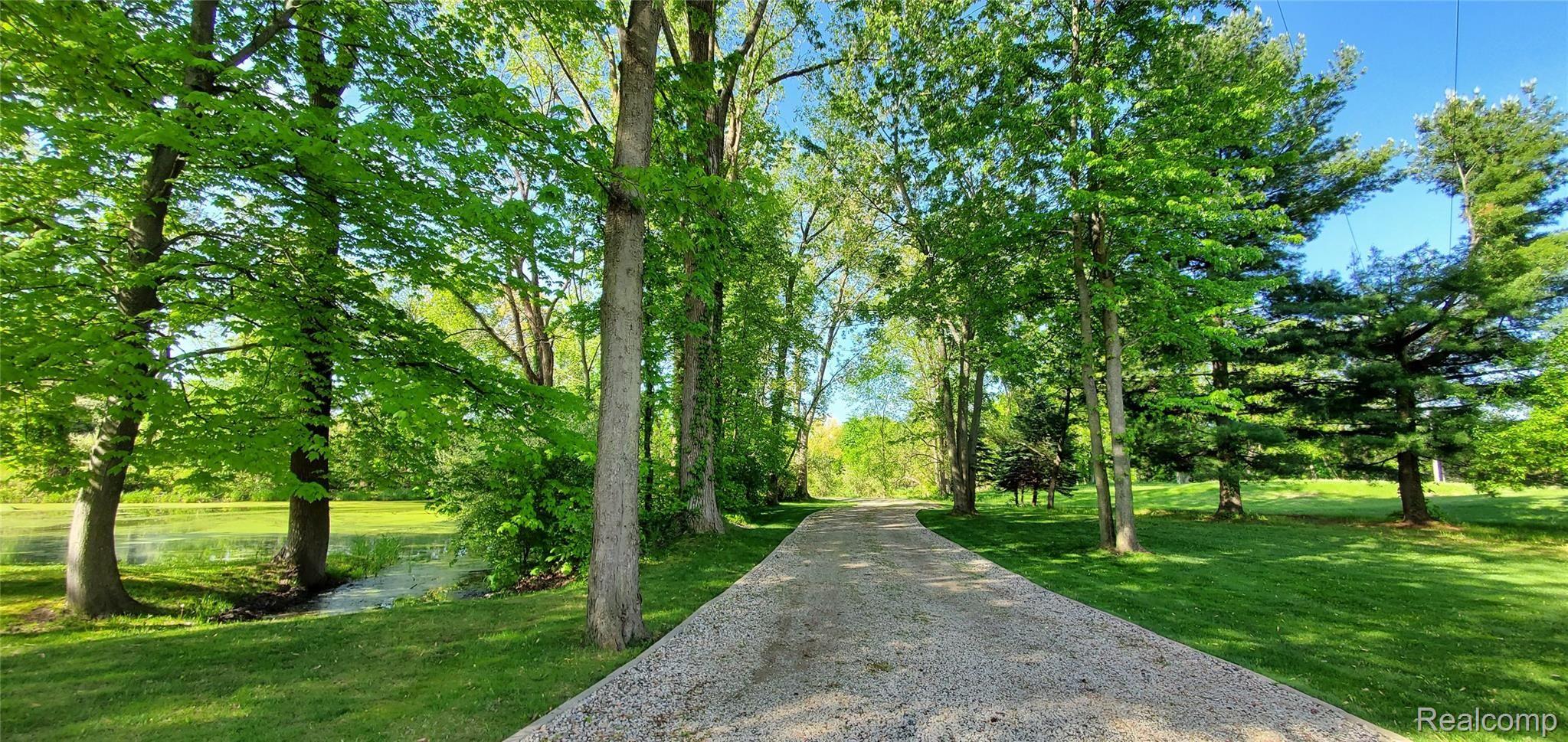5520 Lowe Road Fowlerville, MI 48836 - Photo 86 of 86 Driveway entrance view - park like setting
