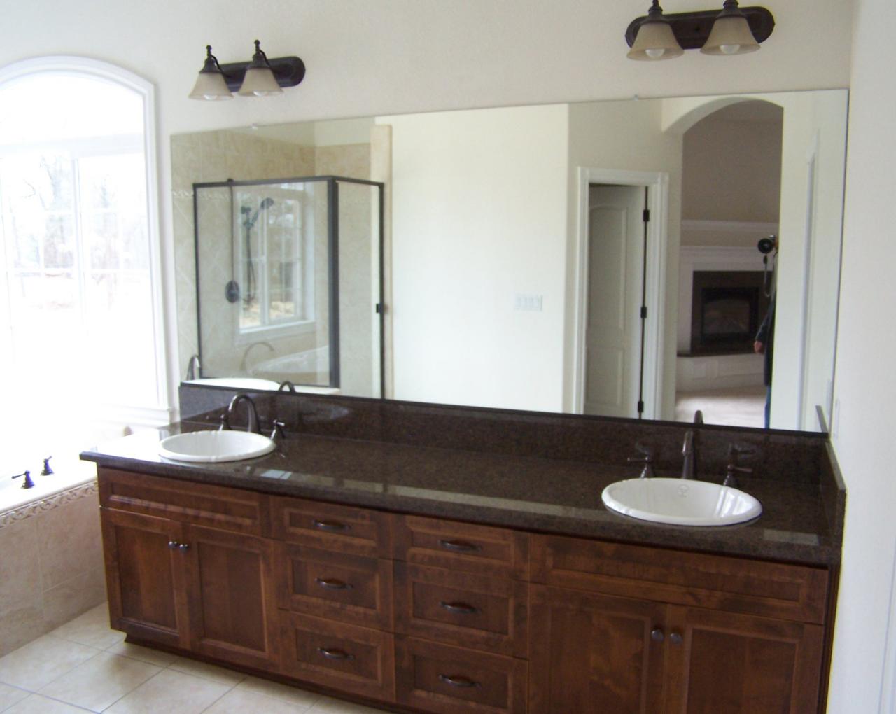 12280 Intermountain Road Redding, CA 96003 - Photo 23 of 45 a bathroom with a granite countertop sink and a mirror