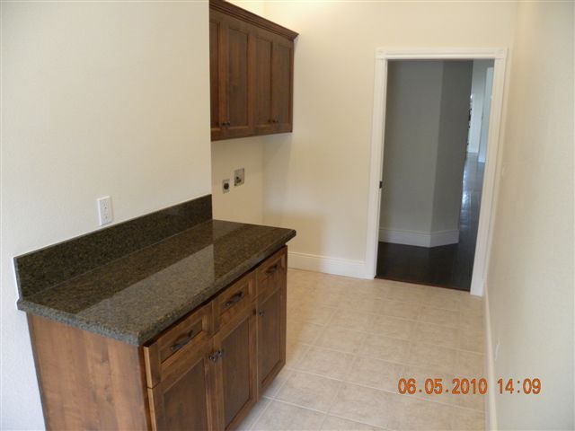 12280 Intermountain Road Redding, CA 96003 - Photo 35 of 45 a kitchen with a sink and a refrigerator