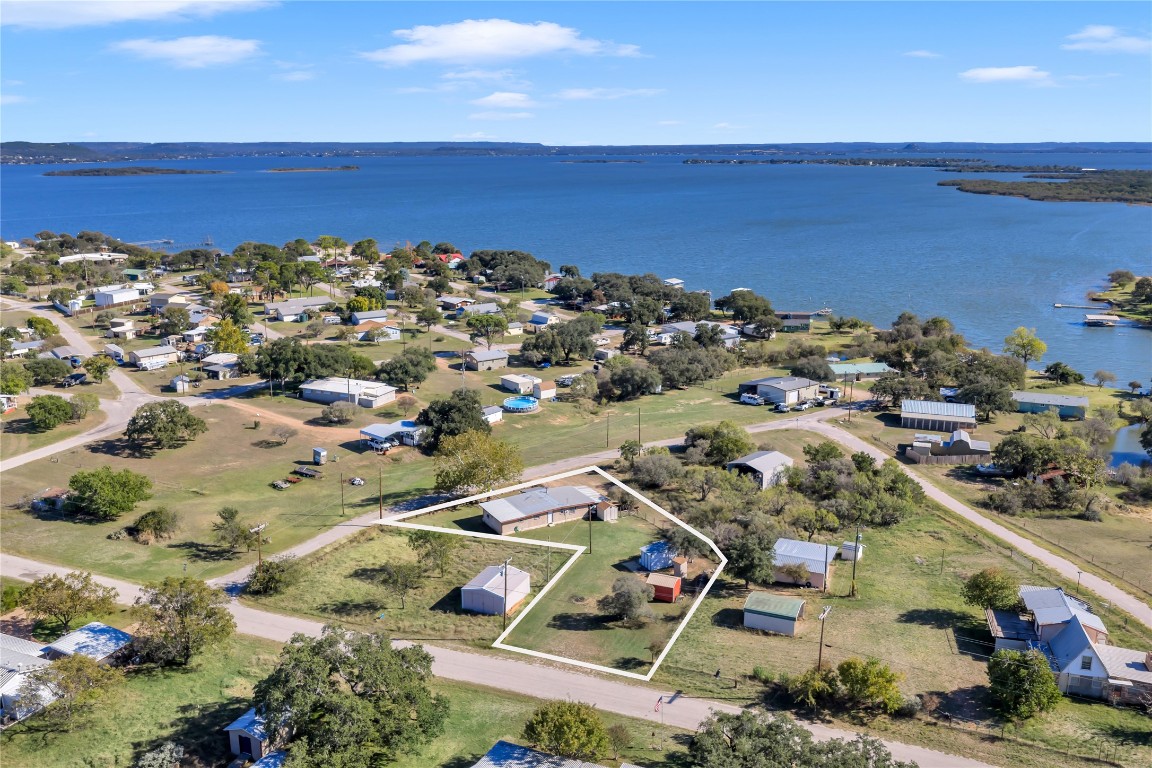 1415 Bee Lane Tow, TX 78672 - Photo 1 of 39 an aerial view of ocean and residential houses with outdoor space