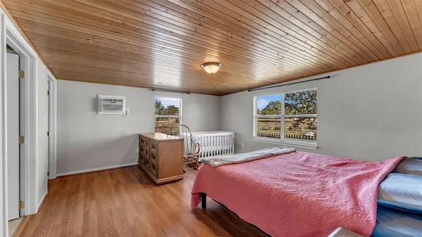 a bedroom with bed room and window