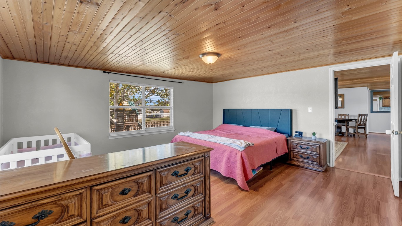 1415 Bee Lane Tow, TX 78672 - Photo 33 of 39 a spacious bedroom with a bed and a window