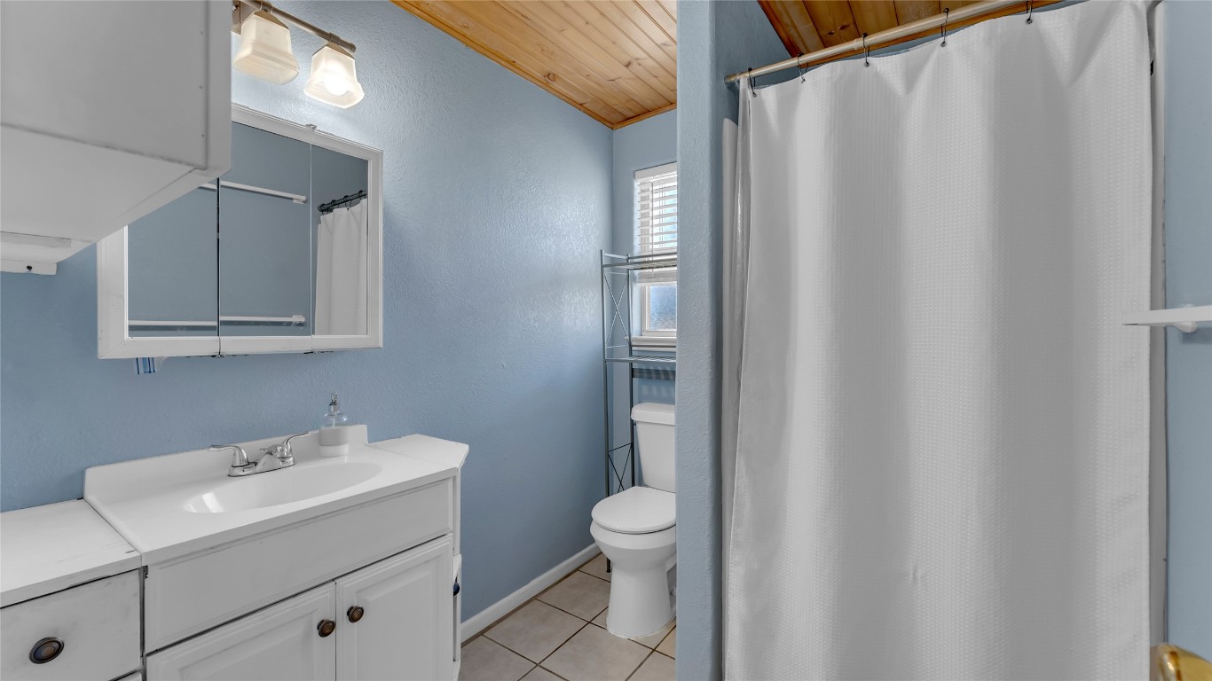 1415 Bee Lane Tow, TX 78672 - Photo 36 of 39 a bathroom with a sink a toilet and shower