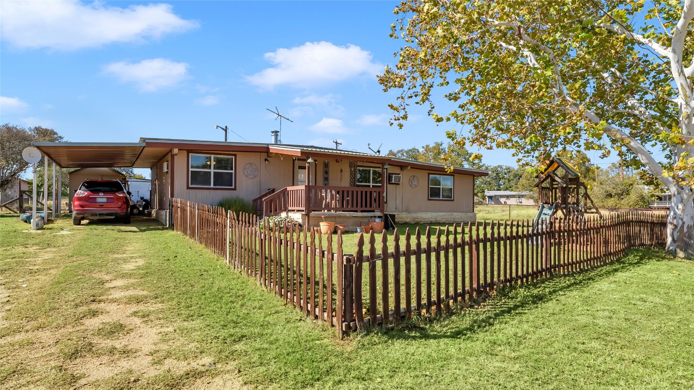 1415 Bee Lane Tow, TX 78672 - Photo 10 of 39 a view of a house with a yard and sitting area