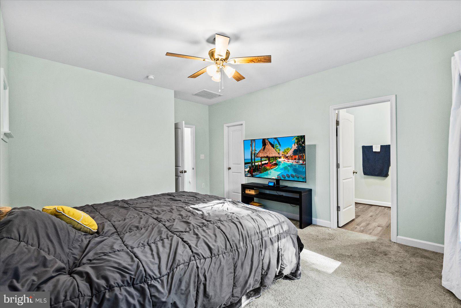 88 Brooks Drive Colonial Beach, VA 22443 - Photo 17 of 36 a bedroom with a bed and a flat screen tv