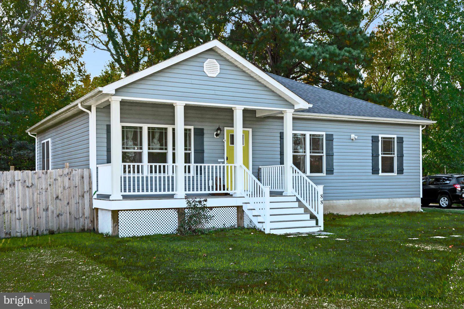 88 Brooks Drive Colonial Beach, VA 22443 - Photo 2 of 36 a front view of a house with a garden