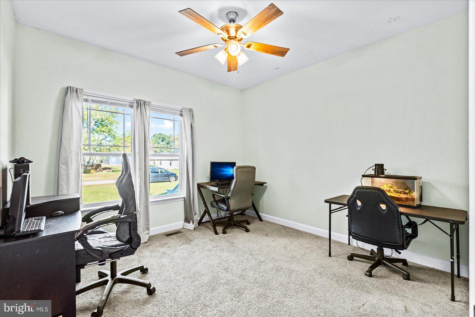 88 Brooks Drive Colonial Beach, VA 22443 - Photo 21 of 36 a view of a workspace with furniture and a window