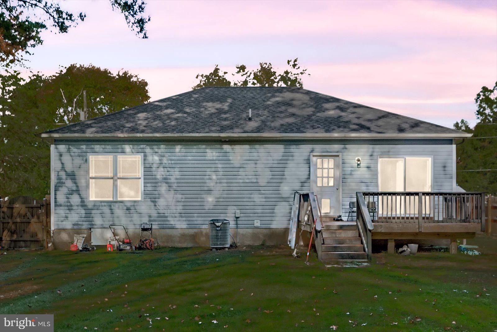 88 Brooks Drive Colonial Beach, VA 22443 - Photo 24 of 36 a view of house with backyard and porch