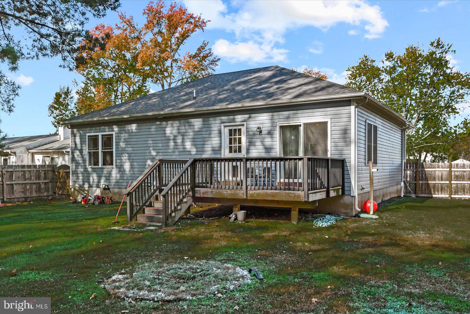88 Brooks Drive Colonial Beach, VA 22443 - Photo 27 of 36 a view of a house with a backyard and a deck