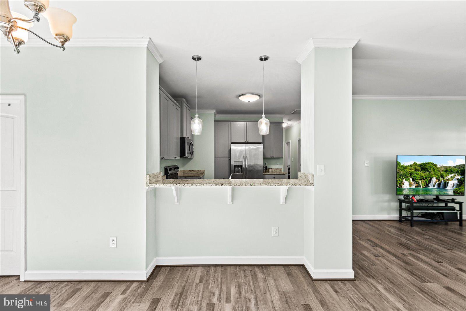 88 Brooks Drive Colonial Beach, VA 22443 - Photo 9 of 36 a view of kitchen with cabinets and wooden floor