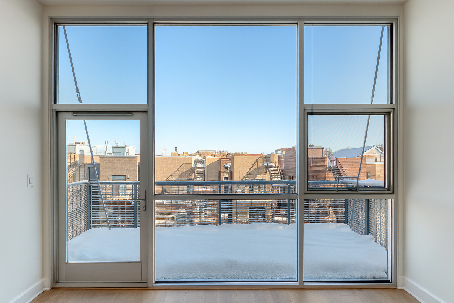 1540 West Fullerton Avenue, Unit 405 Chicago, IL 60614 - Photo 4 of 17 a view of a glass door and a window