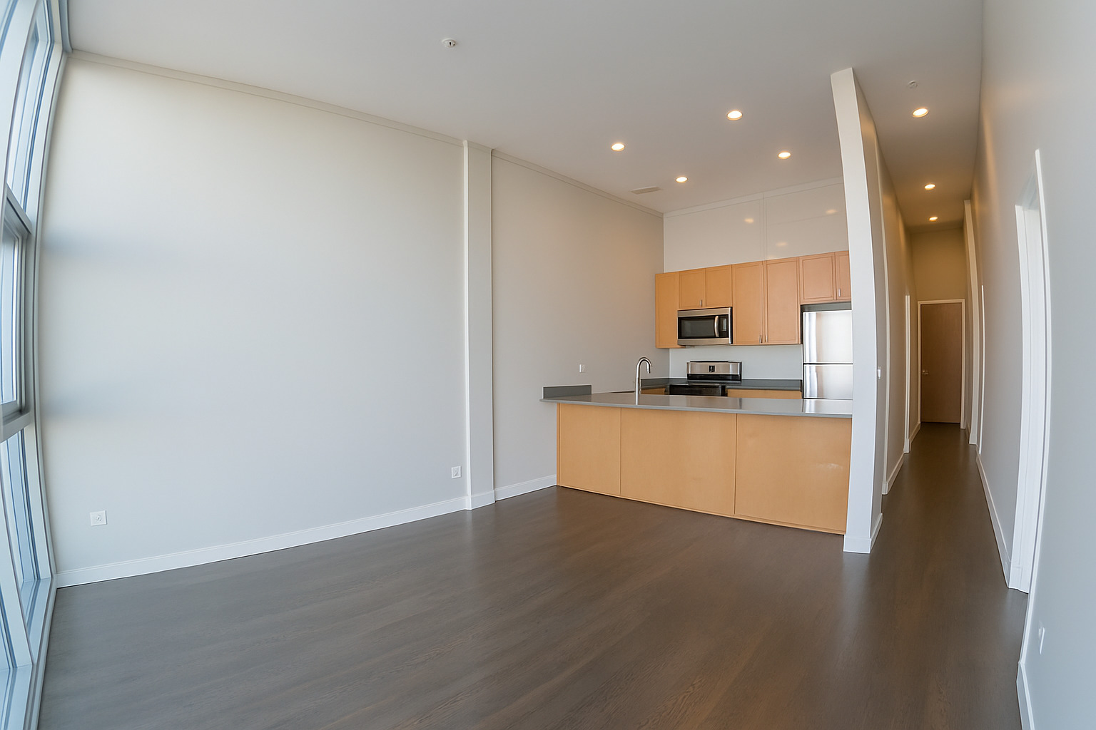 1540 West Fullerton Avenue, Unit 405 Chicago, IL 60614 - Photo 6 of 17 a view of kitchen with kitchen island granite countertop refrigerator and stove top oven