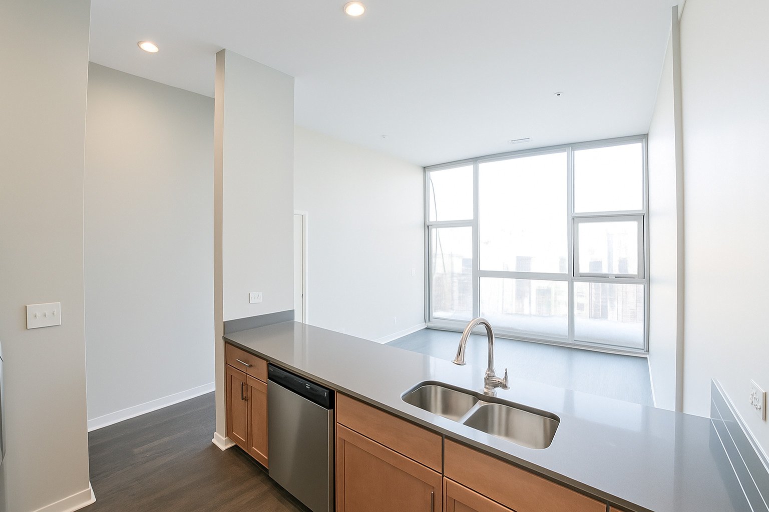 1540 West Fullerton Avenue, Unit 405 Chicago, IL 60614 - Photo 8 of 17 a kitchen with stainless steel appliances granite countertop a sink and a window