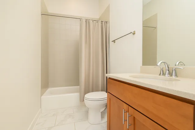 a bedroom with a bed and with furniture