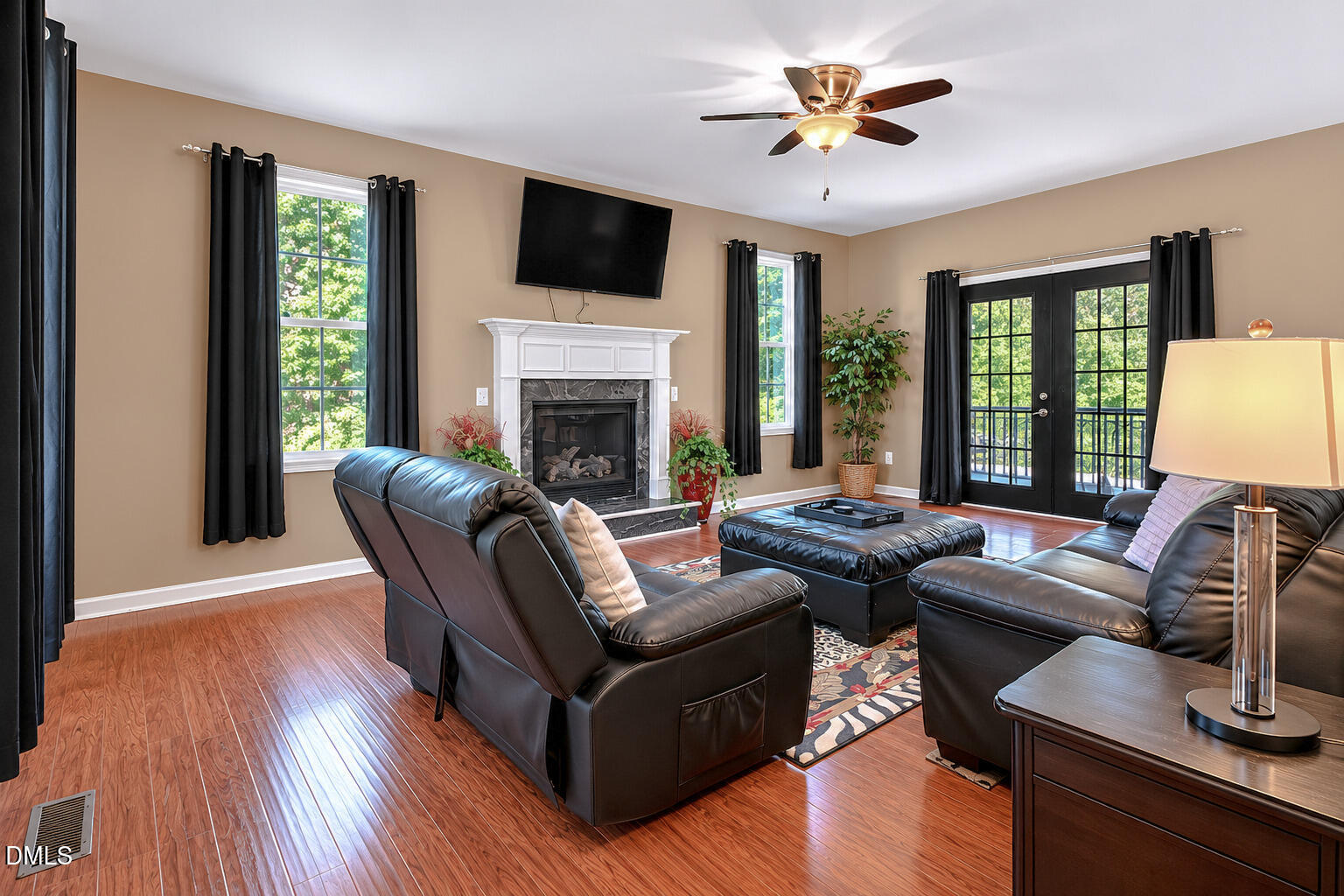923 White Memorial Church Road Willow Spring, NC 27592 - Photo 13 of 46 a living room with furniture fireplace and a flat screen tv