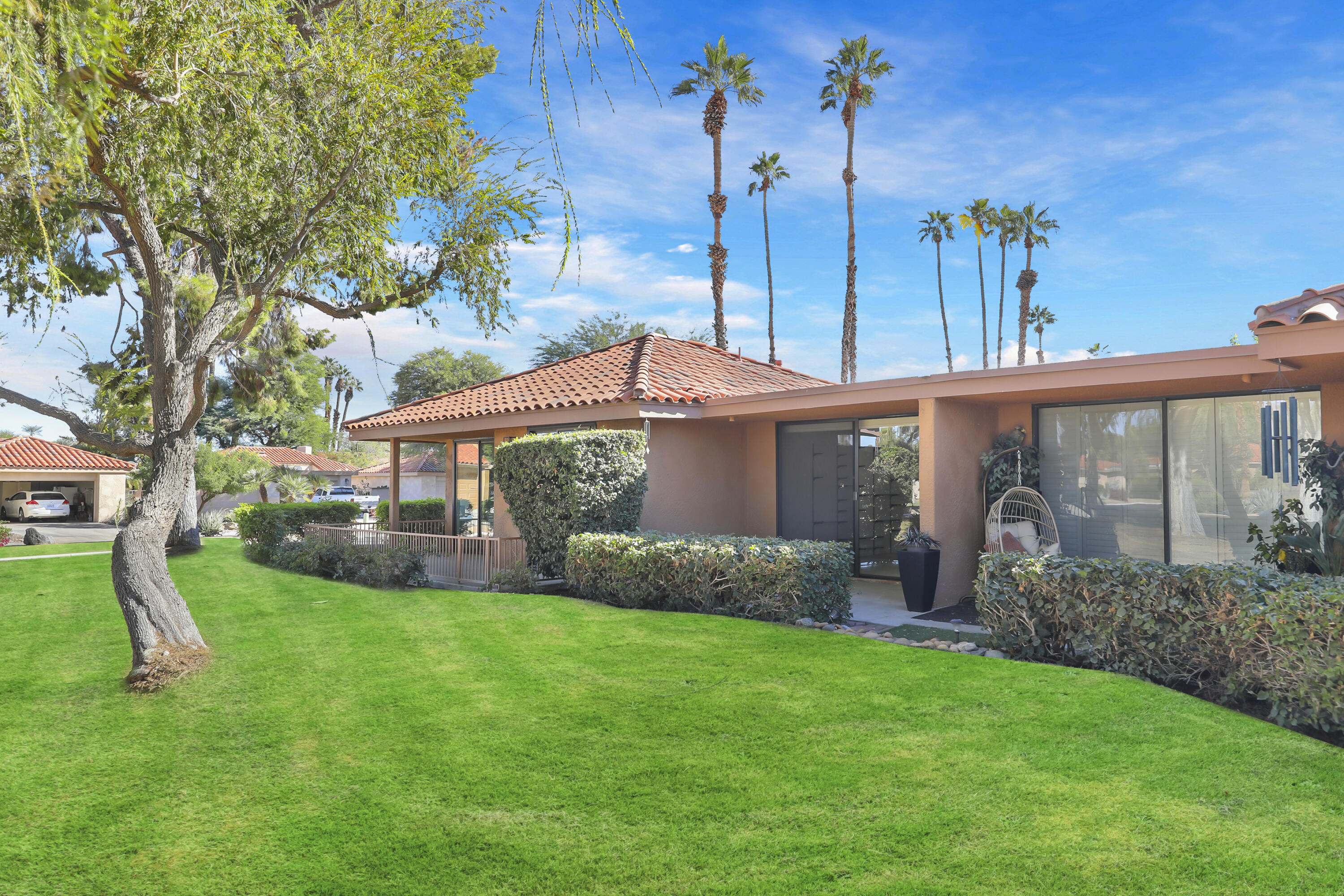 2 Valencia Drive Rancho Mirage, CA 92270 - Photo 14 of 39 a front view of a house with garden