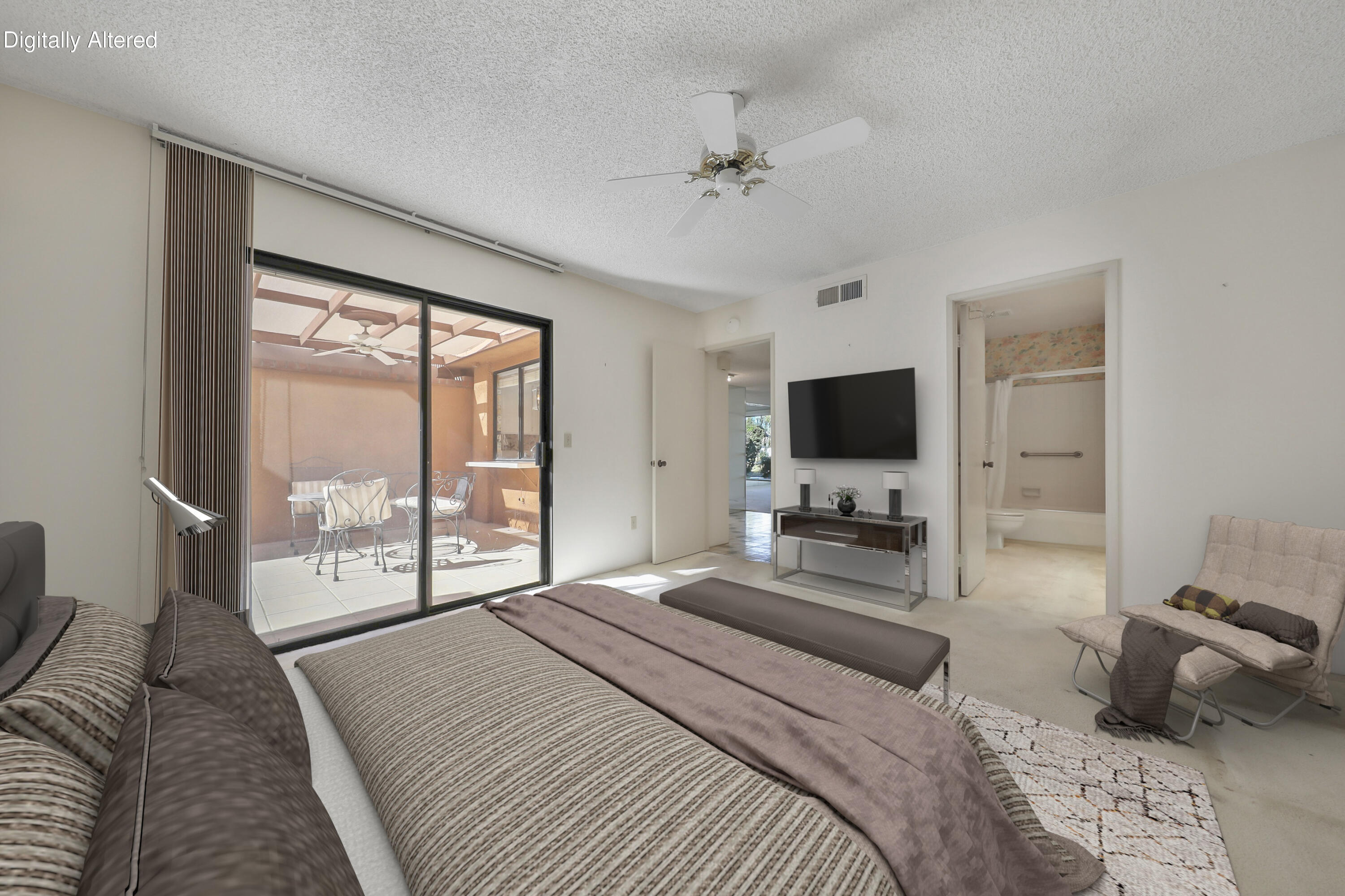 2 Valencia Drive Rancho Mirage, CA 92270 - Photo 9 of 39 a bedroom with a bed a large window and flat screen tv