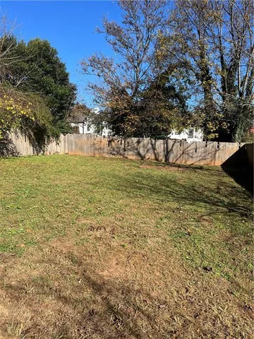 a view of a trees with a yard