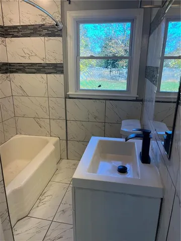 a bathroom with a sink and a bathtub