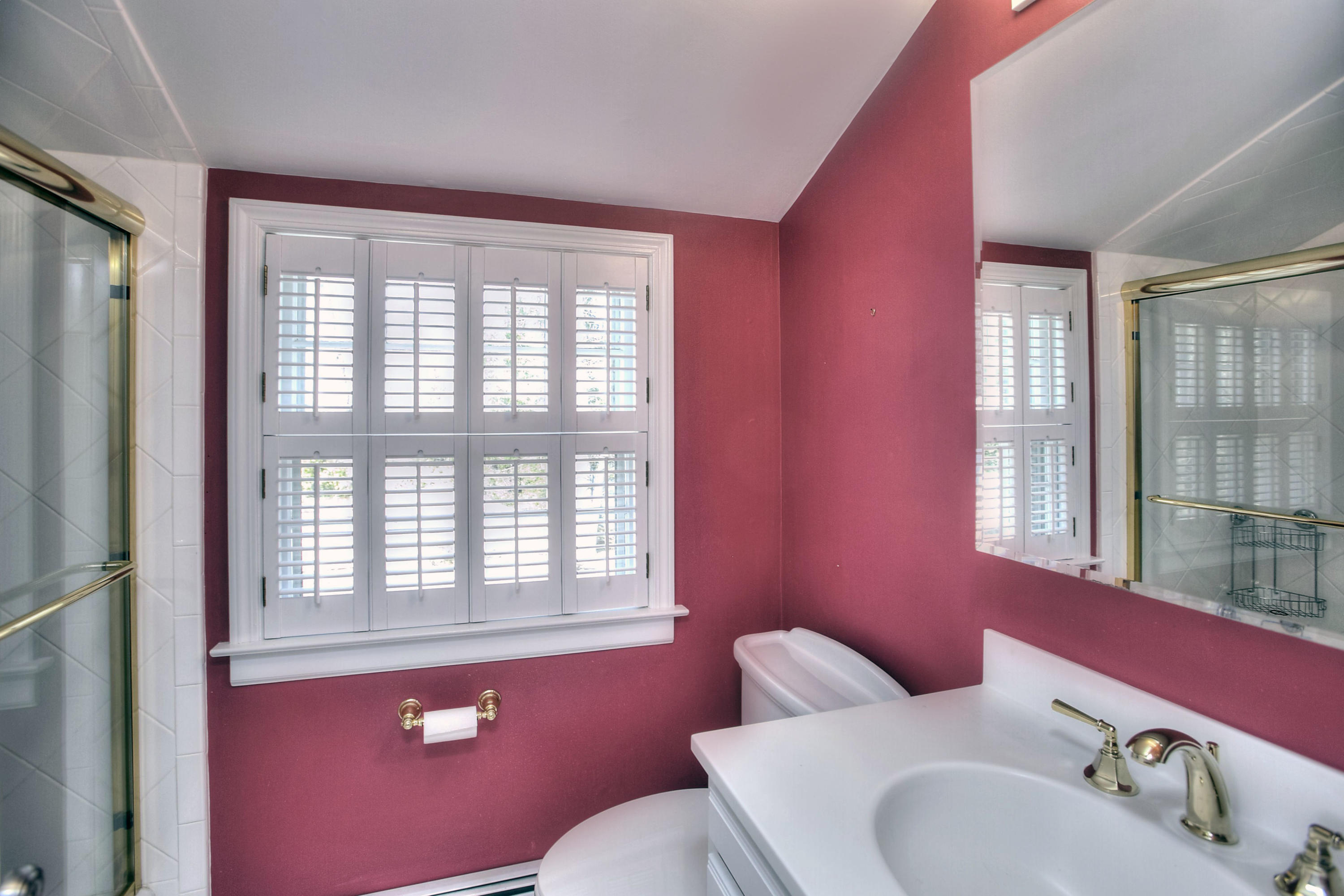 16 Arrowhead Road Wilton, CT 06897 - Photo 18 of 37 a bathroom with a sink mirror and a window