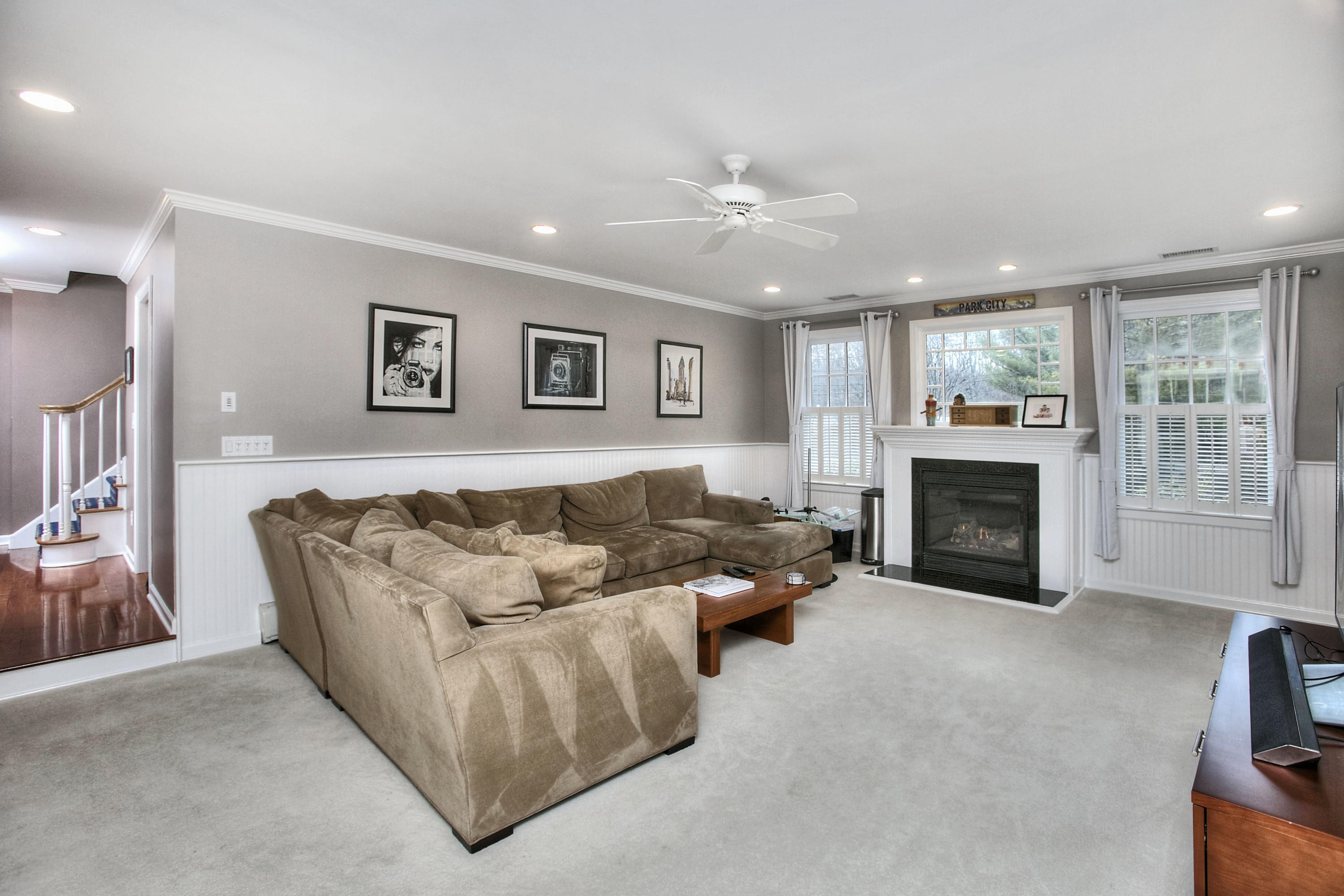 16 Arrowhead Road Wilton, CT 06897 - Photo 19 of 37 a living room with furniture and a fireplace