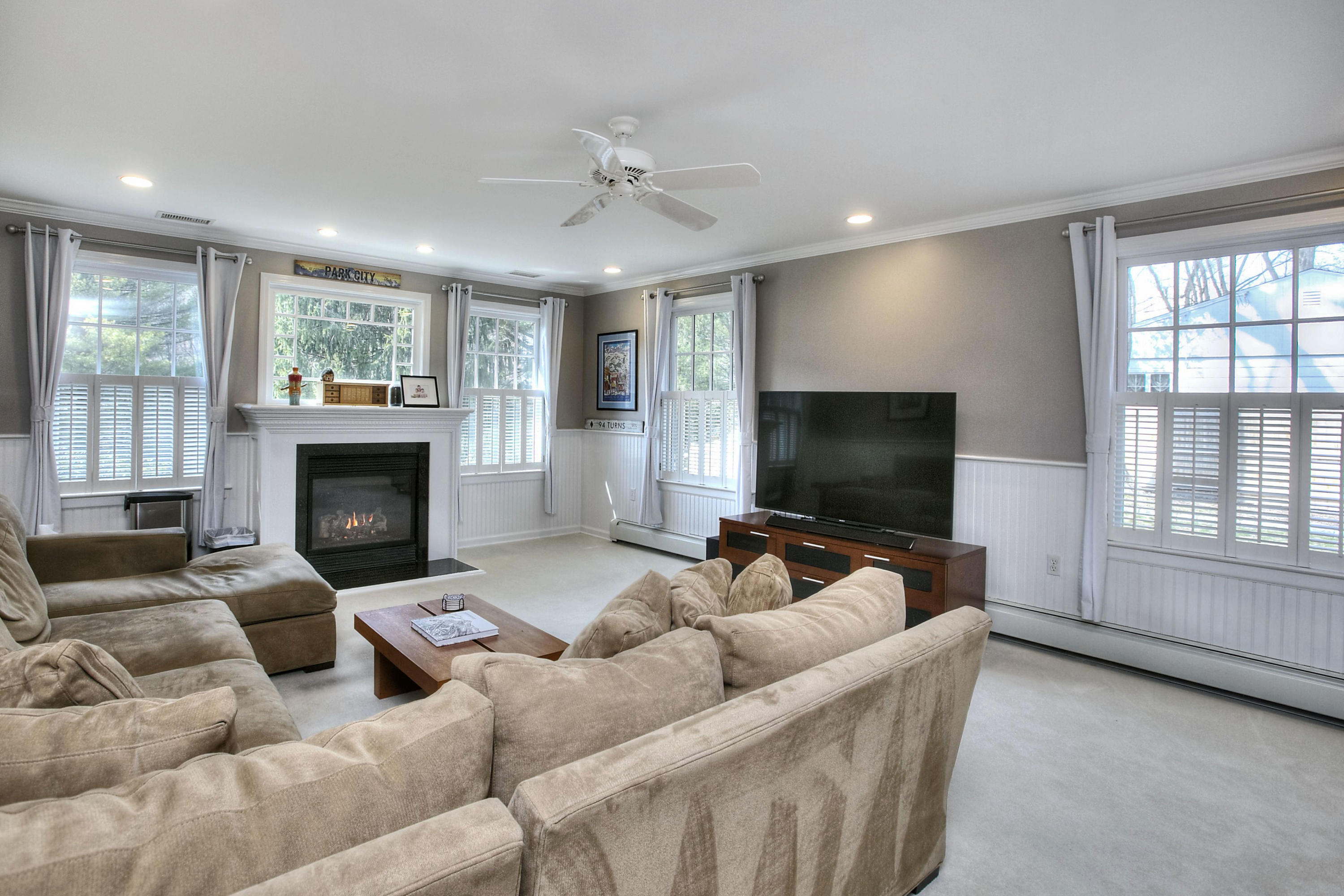 16 Arrowhead Road Wilton, CT 06897 - Photo 21 of 37 a living room with furniture and a flat screen tv