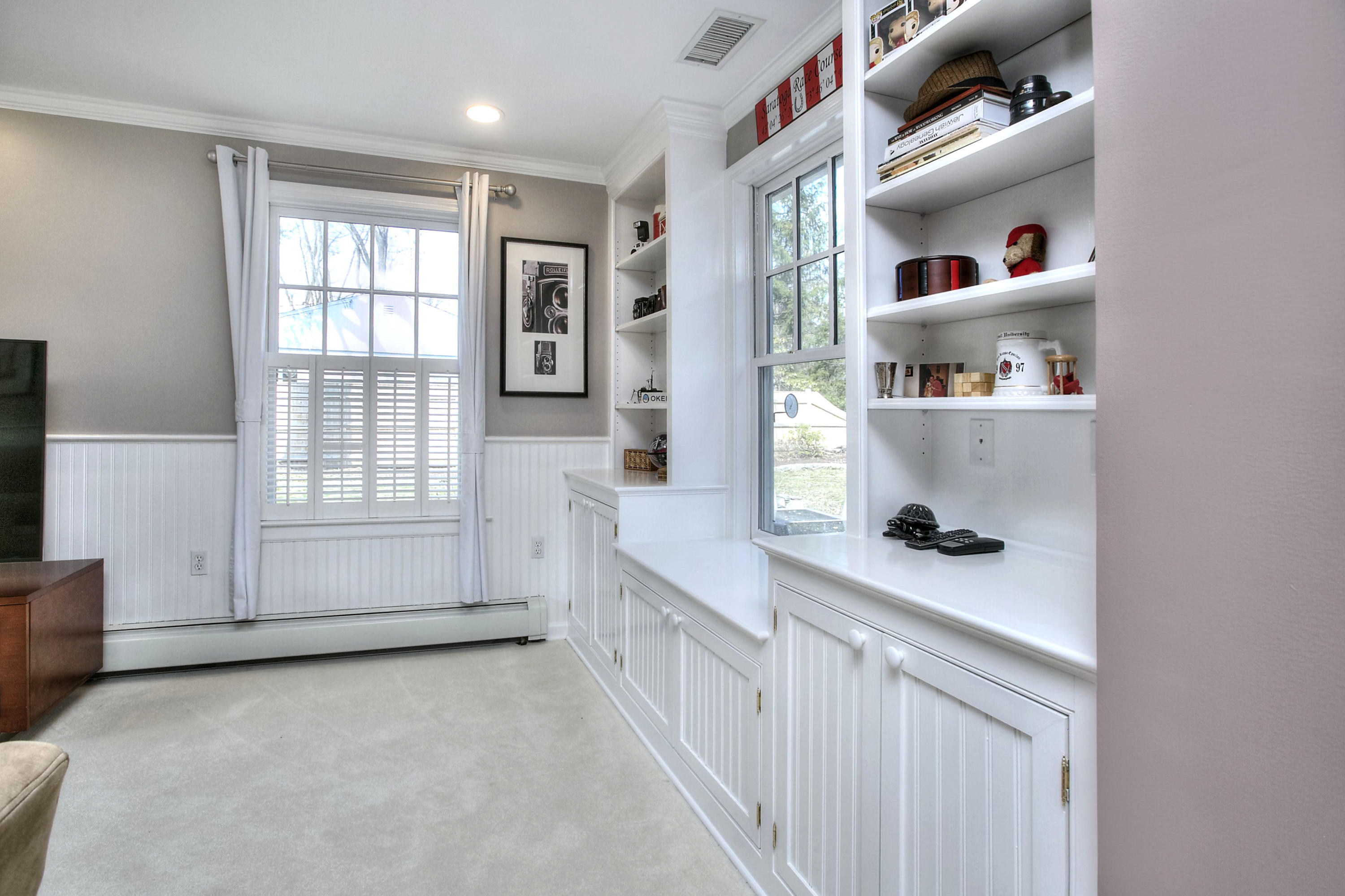 16 Arrowhead Road Wilton, CT 06897 - Photo 22 of 37 a hallway with cabinets and window