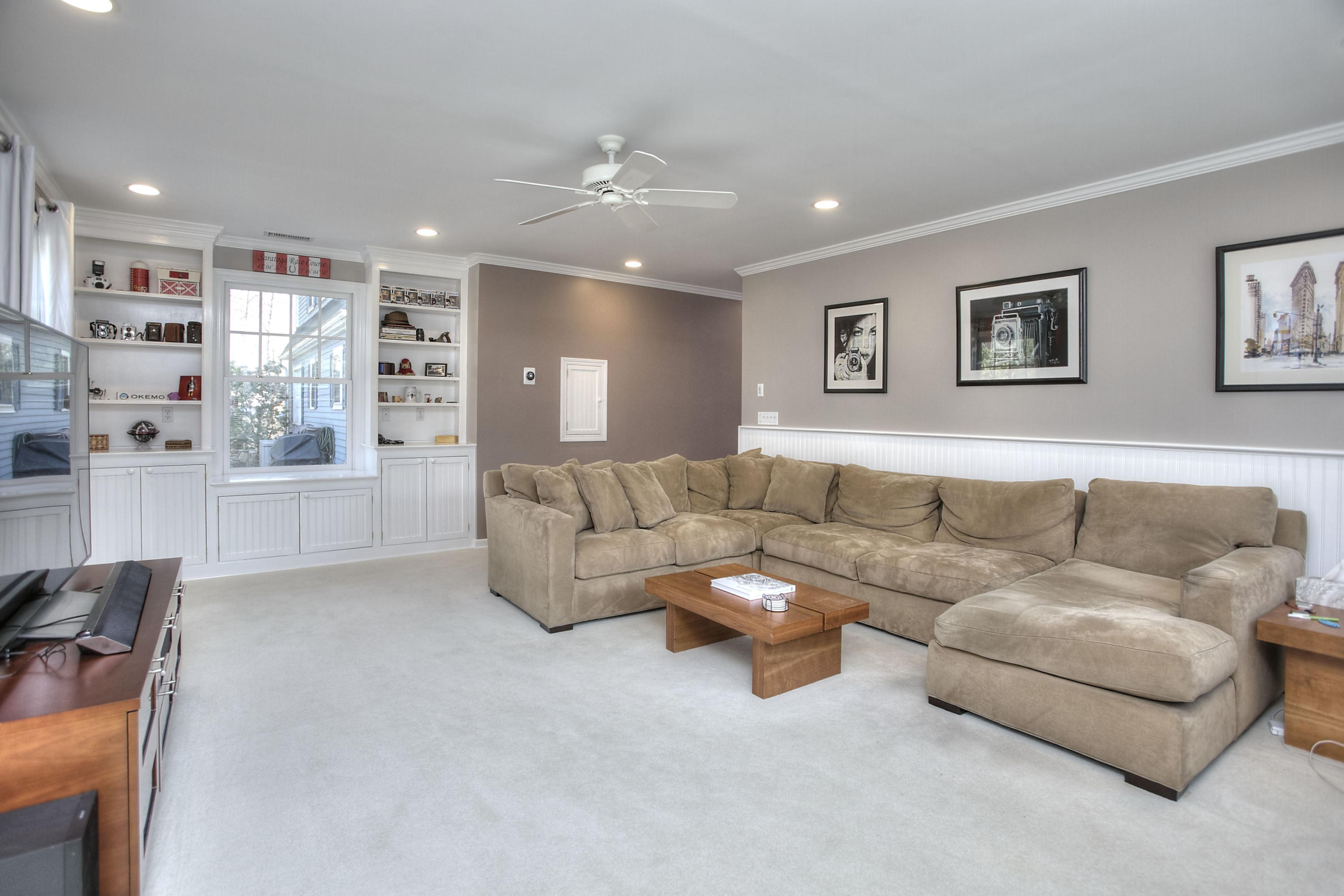 16 Arrowhead Road Wilton, CT 06897 - Photo 23 of 37 a living room with furniture and a kitchen