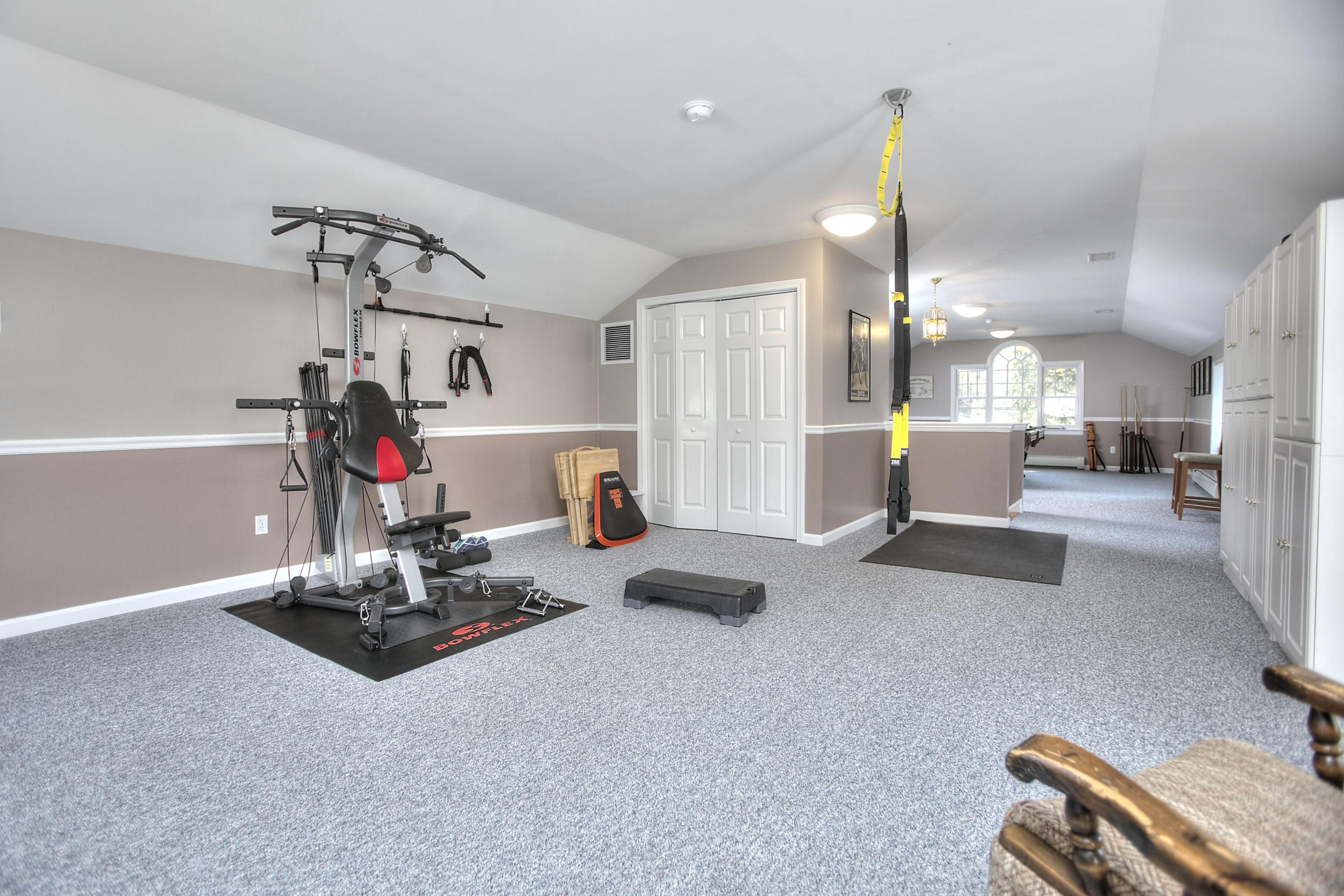 16 Arrowhead Road Wilton, CT 06897 - Photo 27 of 37 a view of a room with gym equipment