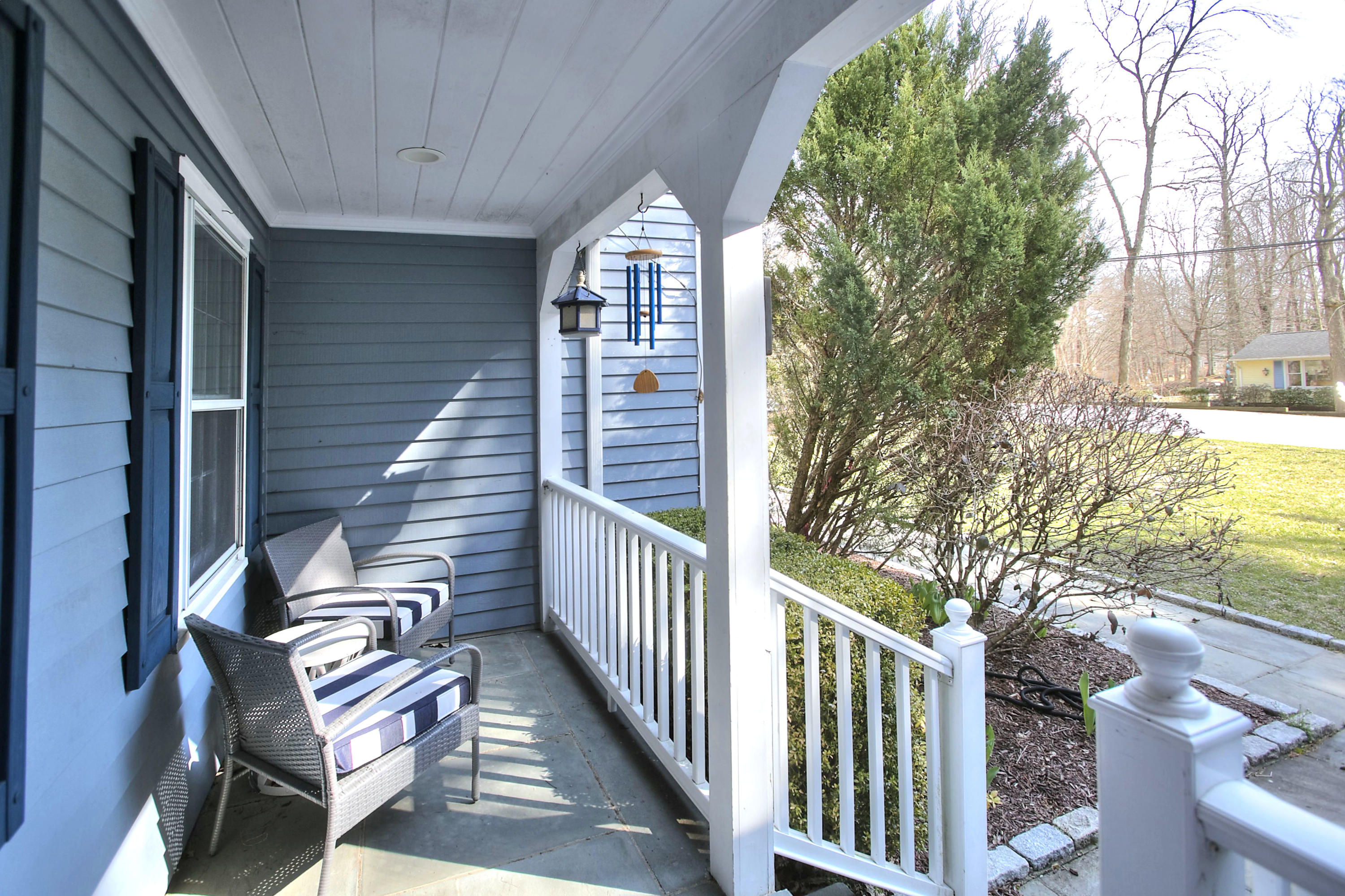 16 Arrowhead Road Wilton, CT 06897 - Photo 32 of 37 a view of a balcony with furniture