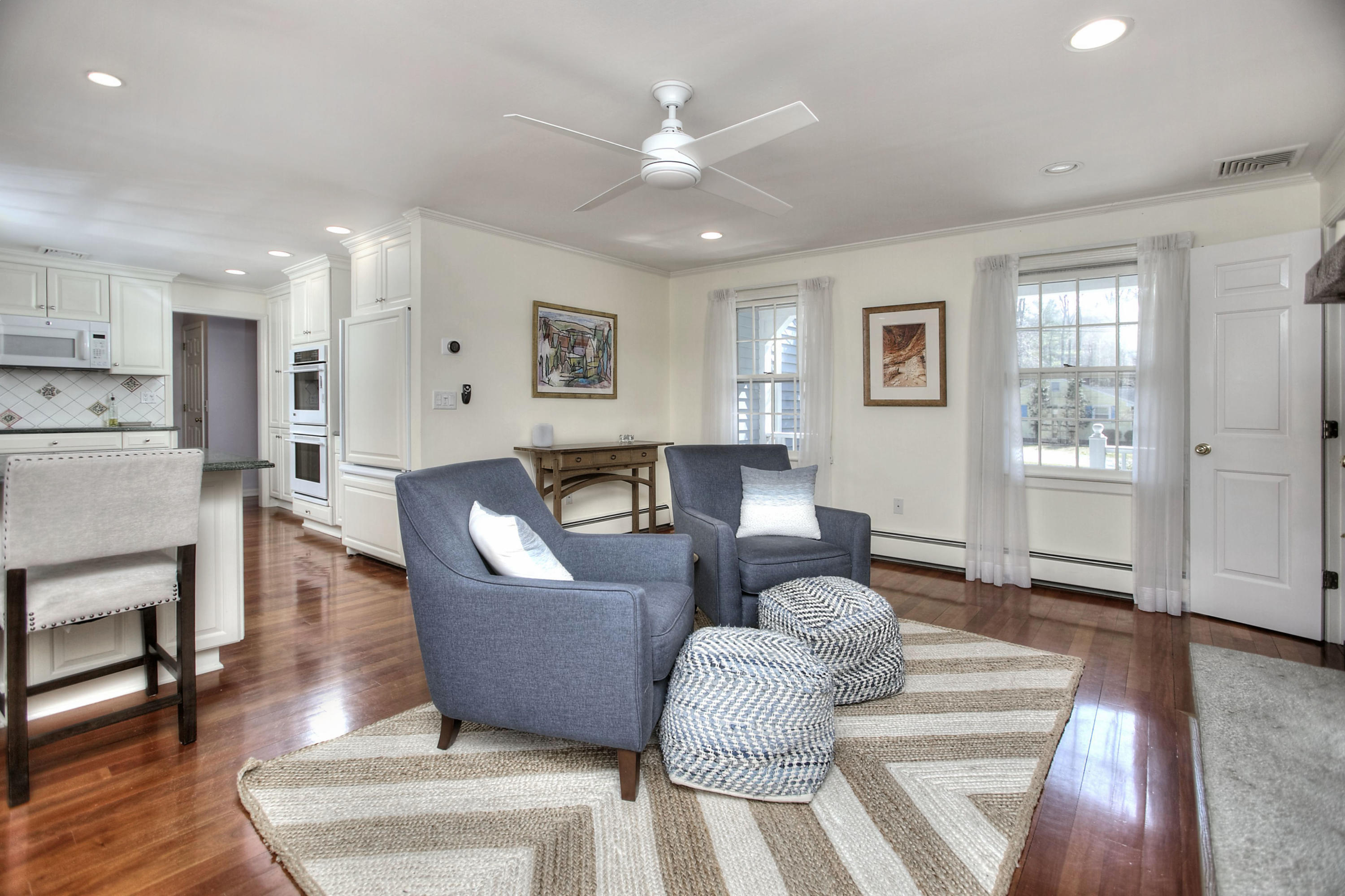 16 Arrowhead Road Wilton, CT 06897 - Photo 7 of 37 a living room with fireplace furniture and a wooden floor