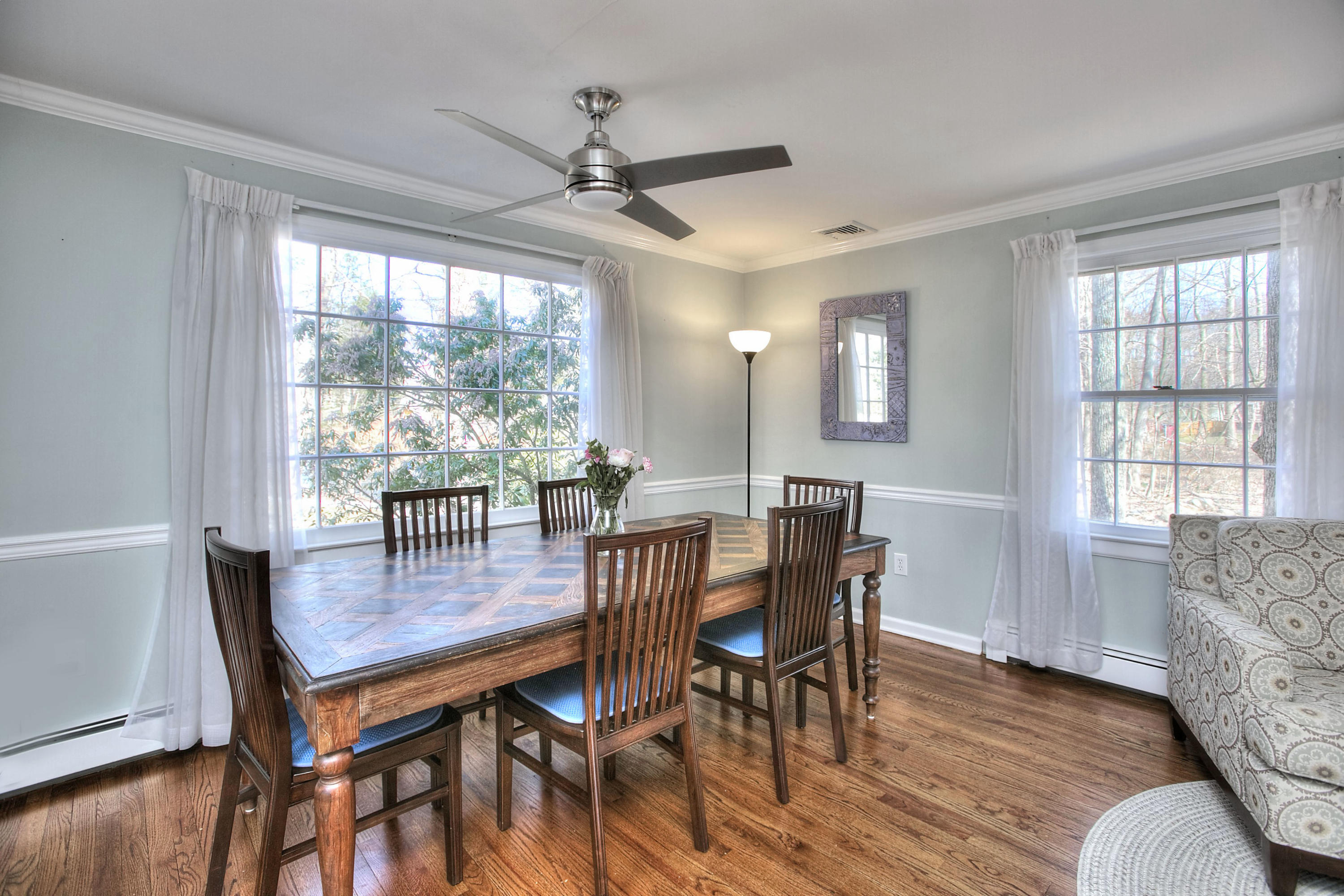 16 Arrowhead Road Wilton, CT 06897 - Photo 10 of 37 a view of a dining room with furniture window and wooden floor