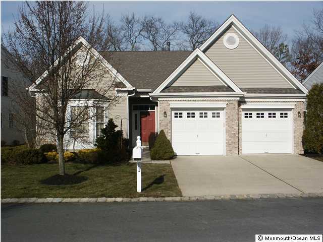 12 Winged Foot Road Jackson, NJ 08527 - Photo 1 of 3 a view of a house next to a yard and road