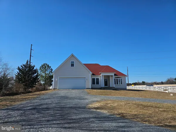 a front view of a house with a ocean view