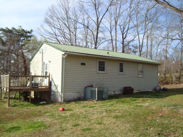1075 Drake Road Adams, TN 37010 - Photo 2 of 4 a backyard of a house with barbeque oven