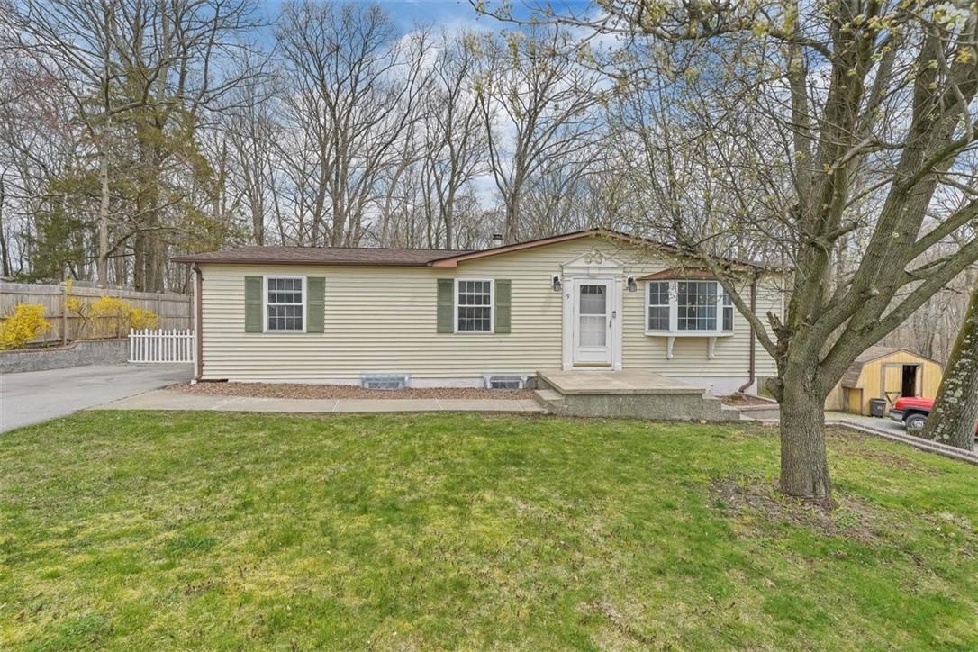 a front view of a house with a yard