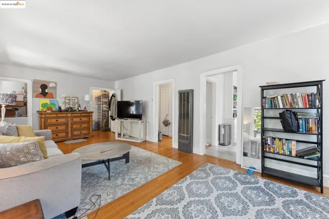 a living room with furniture and a rug