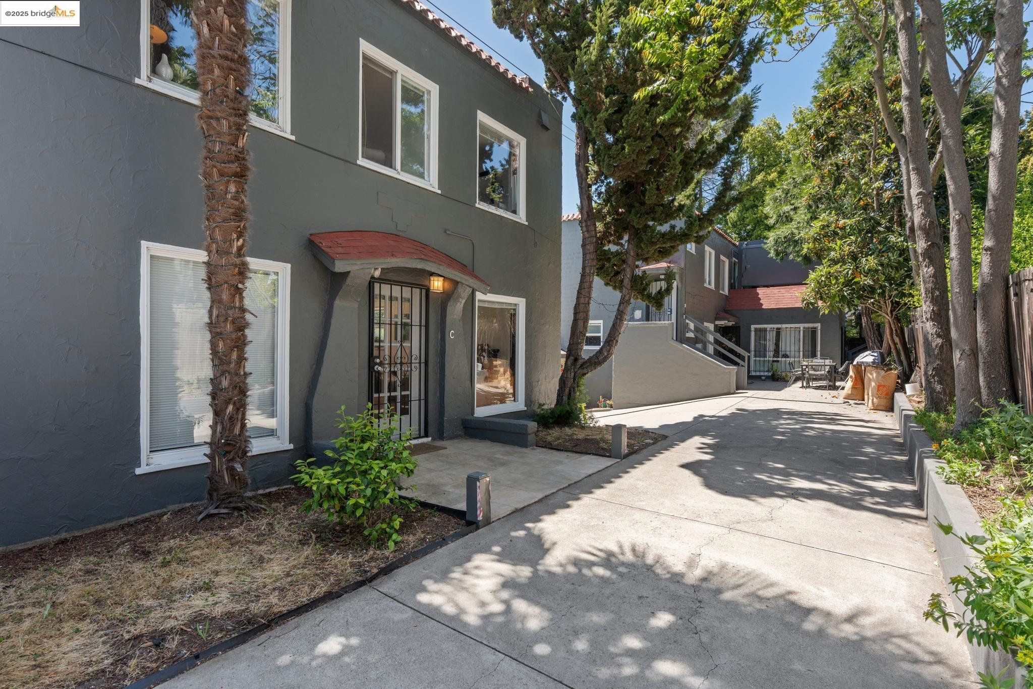 2823 11th Avenue, Unit B Oakland, CA 94610 - Photo 8 of 12 a front view of a house with garden