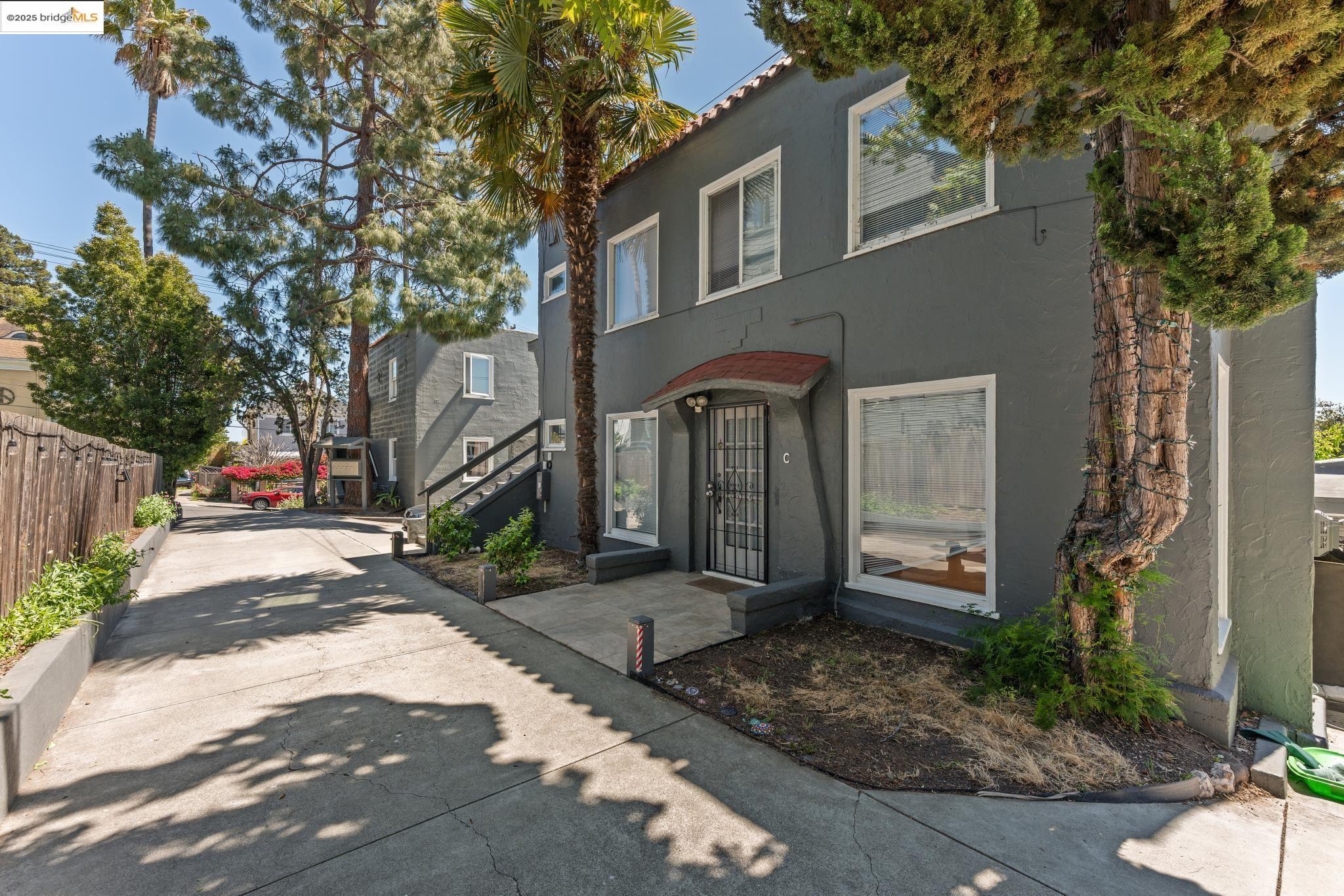 2823 11th Avenue, Unit B Oakland, CA 94610 - Photo 9 of 12 a front view of a house with garden