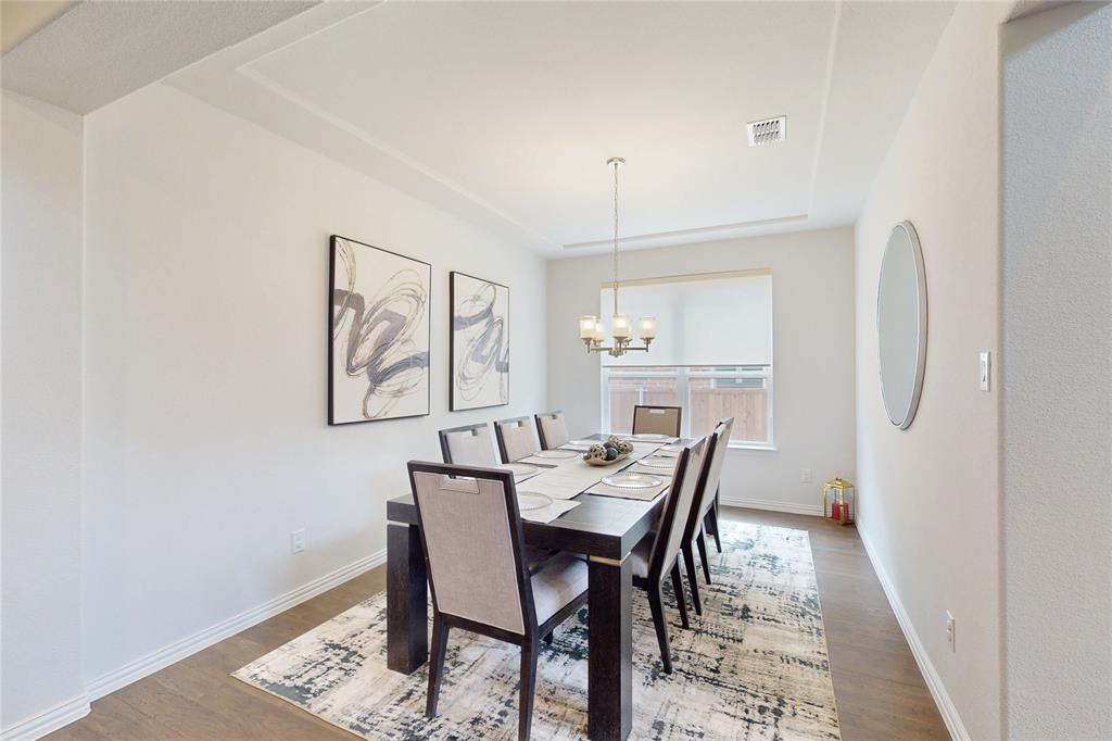 1997 Kieva Place Allen, TX 75013 - Photo 6 of 40 Dining area with light wood-type flooring and a chandelier