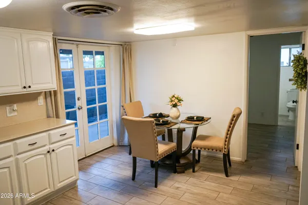 a dining room with furniture and window